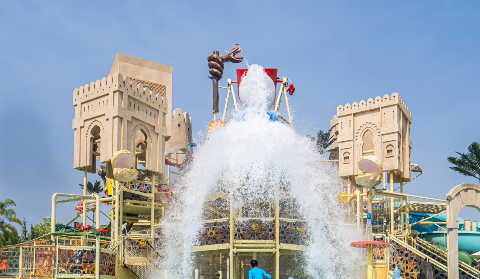 Tipping bucket with water spills onto an aquatic play area